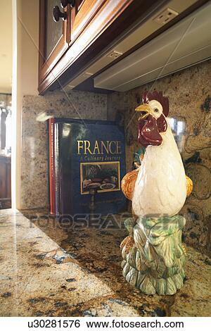 Stock Photograph - Rooster decoration on kitchen countertop; Laguna Beach; California; USA. Fotosearch