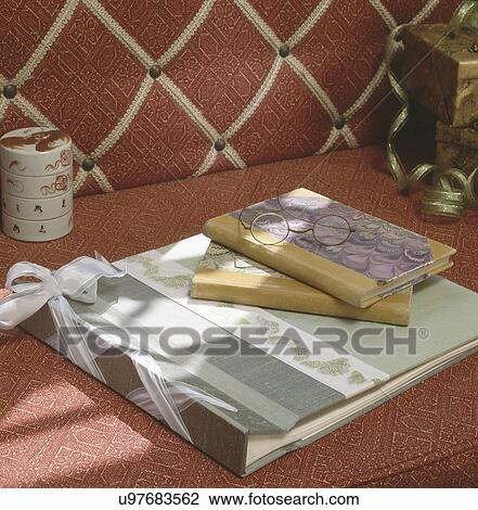 Scrapbook and journals with glasses on counter View Large Photo Image Stock Image - Scrapbook and journals with glasses on counter. Fotosearch