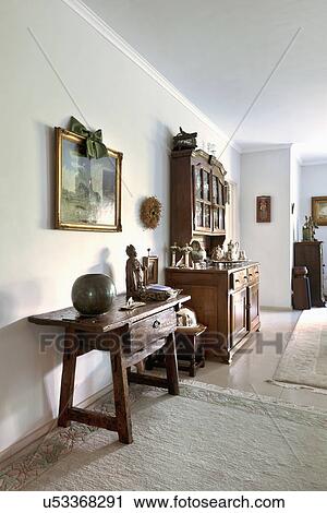 Stock Image - Side board and hutch in traditional living room. Fotosearch