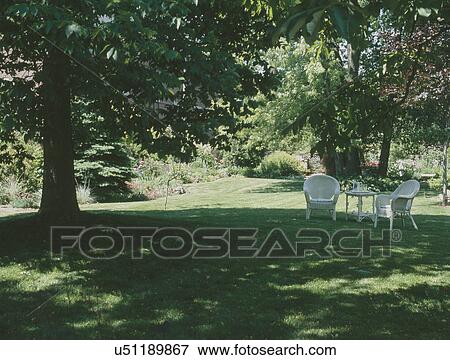 Stock Photo - Sitting area in backyard garden. Fotosearch