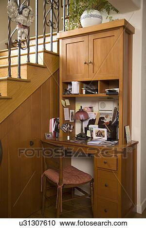 Stock Image - Small desk built in beside staircase; Carpinteria; California; USA. Fotosearch