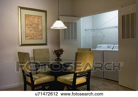 Small dining area and laundry room in apartment home View Large Photo Image Stock Image - Small dining area and laundry room in apartment home. Fotosearch