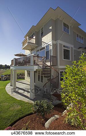 Spiral staircase in single family home View Large Photo Image Stock Photo - Spiral staircase in single family home. Fotosearch