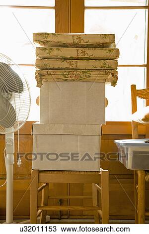 Stacks of moving boxes on chairs; Carpinteria; California; USA View Large Photo Image Stock Image - Stacks of moving boxes on chairs; Carpinteria; California; USA. Fotosearch