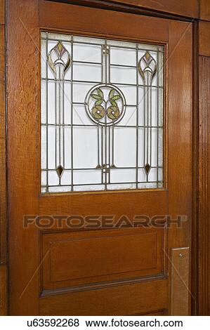 STAINED GLASS: leaded and stained glass in doors of Arts and Crafts, renaissance revival home View Large Photo Image Stock Photo - STAINED GLASS: leaded and stained glass in doors of Arts and Crafts, renaissance revival home. Fotosearch