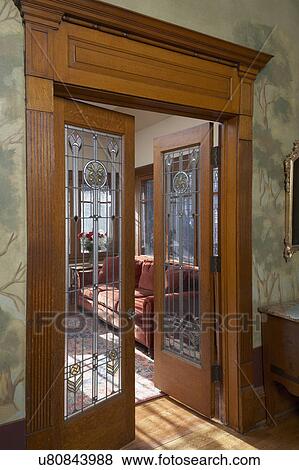 STAINED GLASS: leaded and stained glass in doors of Arts and Crafts Renaissance Revival home, architectural trim work, painted walls with murals of trees View Large Photo Image Stock Photo - STAINED GLASS: leaded and stained glass in doors of Arts and Crafts Renaissance Revival home, architectural trim work, painted walls with murals of trees. Fotosearch