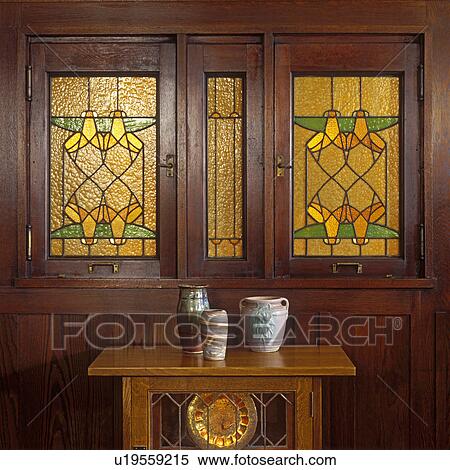 STAINED GLASS WINDOWS: Arts and Craft home, two stained glass windows. Geometric pattern, amber and green, Arch was George Niedecken, built 1905. View Large Photo Image Stock Photography - STAINED GLASS WINDOWS: Arts and Craft home, two stained glass windows. Geometric pattern, amber and green, Arch was George Niedecken, built 1905. . Fotosearch