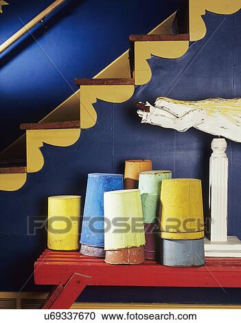 stairs: detail of the scroll work painted colorfully on stairs. colorfully painted sap buckets in blues and yellows, folk art angel, some images with cat View Large Photo Image Stock Image - stairs: detail of the scroll work painted colorfully on stairs. colorfully painted sap buckets in blues and yellows, folk art angel, some images with cat. Fotosearch