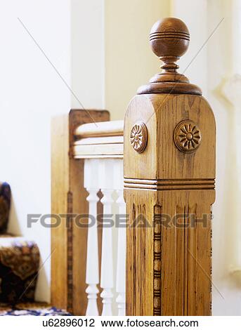 STAIRWAYS: Restored Victorian home, natural stained oak railing and newel posts, white painted balusters, close up of newel post View Large Photo Image Stock Image - STAIRWAYS: Restored Victorian home, natural stained oak railing and newel posts, white painted balusters, close up of newel post . Fotosearch