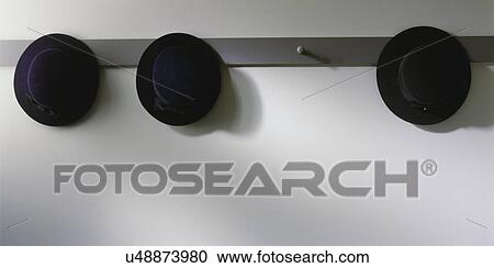 STILL LIFE: Three Amish men's hats hang on a peg rack, View Large Photo Image Stock Image - STILL LIFE: Three Amish men's hats hang on a peg rack,. Fotosearch