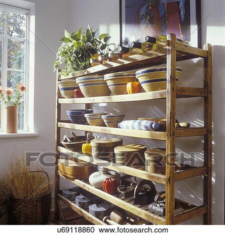 STORAGE IDEAS: Wooden drying, cooling rack. Old irons, pottery dishes, wine. View Large Photo Image Stock Image - STORAGE IDEAS: Wooden drying, cooling rack. Old irons, pottery dishes, wine.. Fotosearch