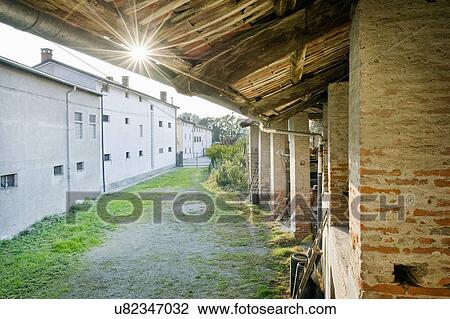Stock Image - Street with residential buildings in Albiano d'Ivrea, Italy. Fotosearch
