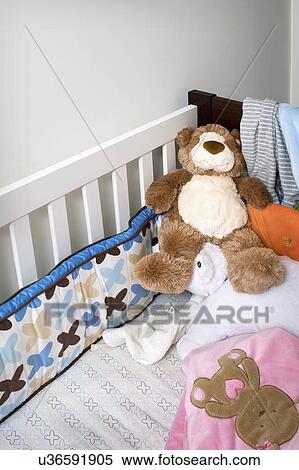 Stuffed bear in crib View Large Photo Image Stock Photography - Stuffed bear in crib. Fotosearch
