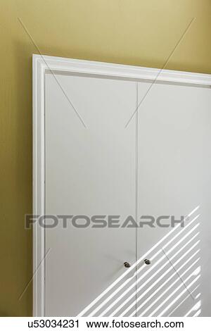 Sunlight streaming over closet doors; Burbank; California; USA View Large Photo Image Stock Image - Sunlight streaming over closet doors; Burbank; California; USA. Fotosearch