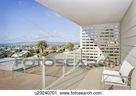 Stock Image - Sunlounger with seating furniture in balcony, San Diego, California, USA. Fotosearch