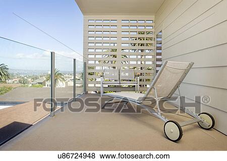 Sunlounger with seating furniture in balcony, San Diego, California, USA View Large Photo Image Stock Photo - Sunlounger with seating furniture in balcony, San Diego, California, USA. Fotosearch