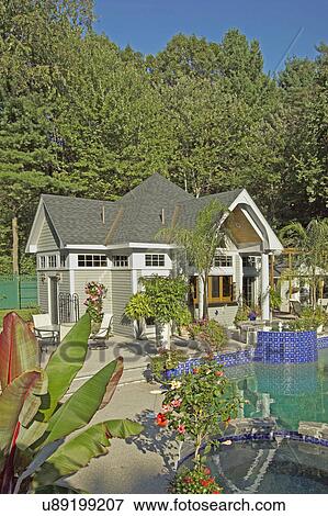 swimming pool in front of house