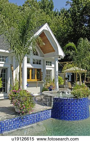 Swimming pool in front of pool house View Large Photo Image Stock Photography - Swimming pool in front of pool house. Fotosearch