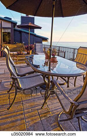 Table on patio with ocean view; Laguna Beach; California; USA View Large Photo Image Picture - Table on patio with ocean view; Laguna Beach; California; USA. Fotosearch
