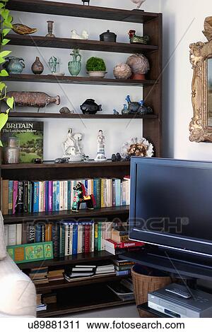 Television and bookcase in living room View Large Photo Image Stock Image - Television and bookcase in living room. Fotosearch