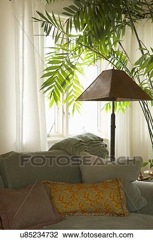 Throw pillows on sofa in living room; Carpinteria; California; USA View Large Photo Image Stock Image - Throw pillows on sofa in living room; Carpinteria; California; USA. Fotosearch