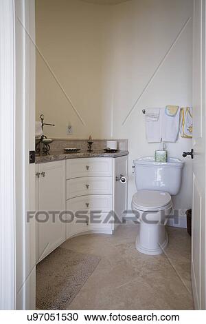 Stock Image - Toilet in traditional bathroom, Laguna Beach, California, USA. Fotosearch