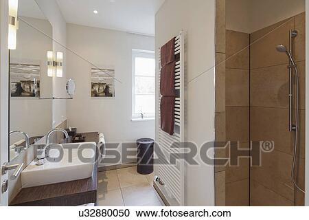 Towel warmer and shower in contemporary bathroom View Large Photo Image Stock Image - Towel warmer and shower in contemporary bathroom. Fotosearch