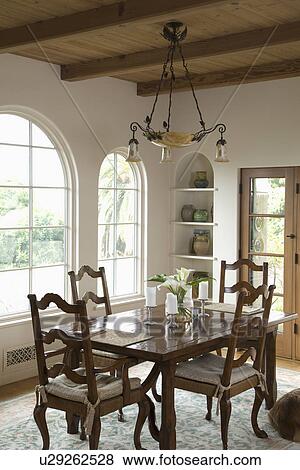 Stock Photo - Traditional dining room with ladder back chairs; Carpinteria; California; USA. Fotosearch
