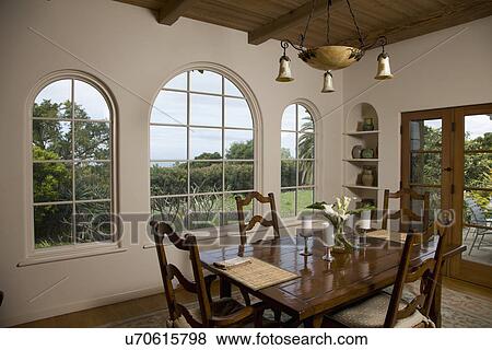 Traditional dining room with ladder back chairs; Carpinteria; California; USA View Large Photo Image Stock Photo - Traditional dining room with ladder back chairs; Carpinteria; California; USA. Fotosearch