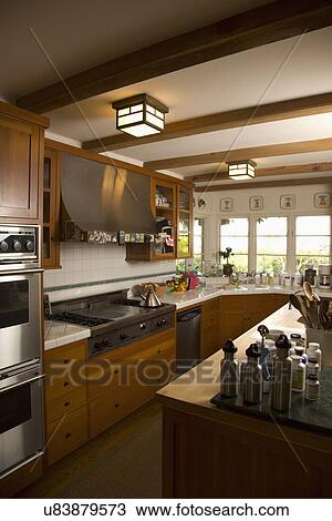 Stock Image - Traditional kitchen with wooden cabinets; Carpinteria; California; USA. Fotosearch