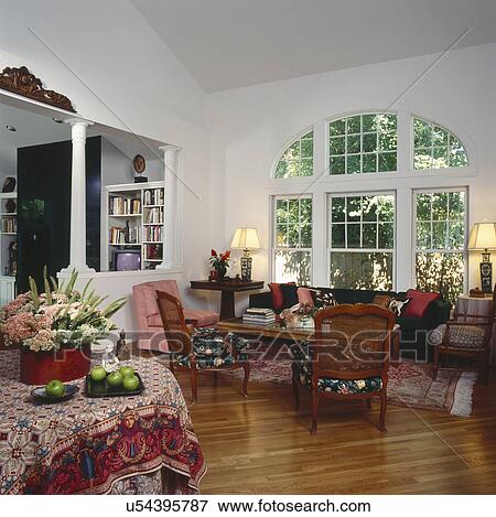 Traditional living room with hardwood floor and bay windows View Large Photo Image Stock Photo - Traditional living room with hardwood floor and bay windows. Fotosearch