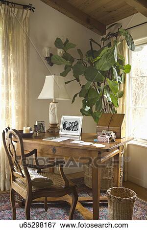 Stock Photo - Traditional wooden desk in corner; Carpinteria; California; USA. Fotosearch