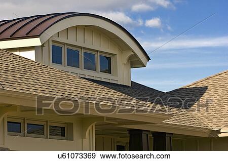 Stock Photo - Unique dormer design with custom home. Fotosearch