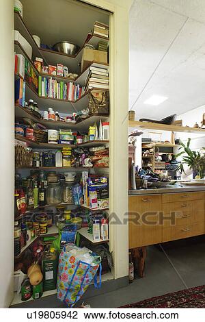 Stock Image - Variety of objects stored in shelves. Fotosearch