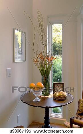 Stock Photography - Victorian style table with flowers and oranges; Monterey; California; USA. Fotosearch