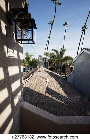 Stock Image - View across shingled rooftop of average home, Laguna Beach, California, USA. Fotosearch