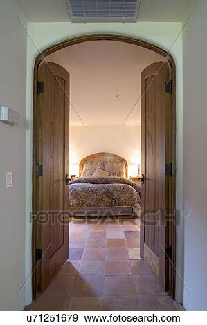 View of a bedroom through the doorway; Monterey; California; USA View Large Photo Image Stock Photo - View of a bedroom through the doorway; Monterey; California; USA. Fotosearch