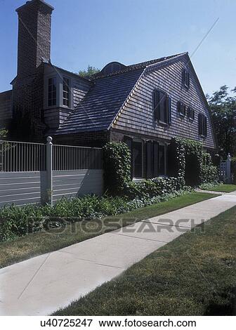 View of house from street; brick with second and third floor with cedar shake siding; cedar roof; wood privacy fence; ivy growing around entrance; concrete sidewalk lawn and border of flowers; Illinois; USA View Large Photo Image Stock Photo - View of house from street; brick with second and third floor with cedar shake siding; cedar roof; wood privacy fence; ivy growing around entrance; concrete sidewalk lawn and border of flowers; Illinois; USA. Fotosearch