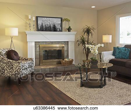 Stock Photography - View of living room with fireplace in model home, California, USA. Fotosearch