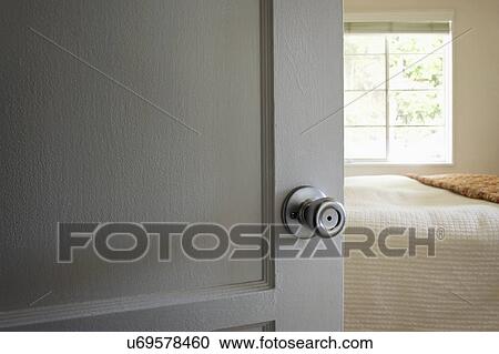 Stock Image - View through doorway to bedroom, San Diego, California, United States of America. Fotosearch