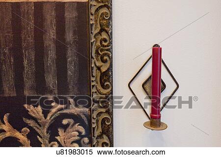Stock Photography - Wall sconce with candle; Seal Beach; California; USA. Fotosearch