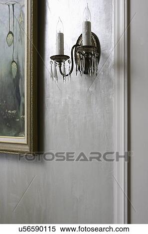 Stock Photography - WALL TREATMENTS: special Amour coat plaster paint, iridescent pale blues and silver, candle sconce, part of picture. Fotosearch