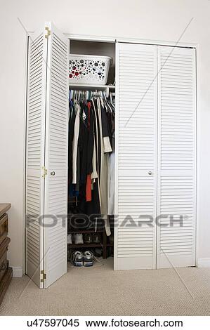 Wardrobe with an open door View Large Photo Image Stock Photography - Wardrobe with an open door. Fotosearch