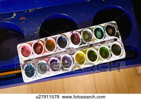 Stock Photo - Watercolors on kid's easel. Fotosearch
