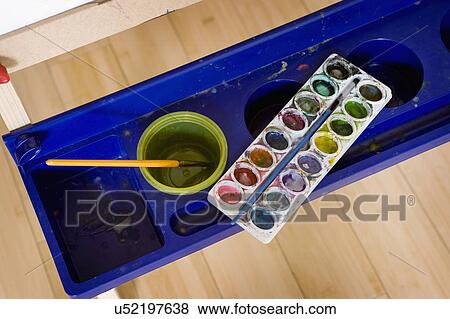 Stock Photo - Watercolors on kid's easel. Fotosearch