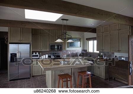Western style kitchen with breakfast bar and island; Porterville; California; USA View Large Photo Image Stock Photo - Western style kitchen with breakfast bar and island; Porterville; California; USA. Fotosearch