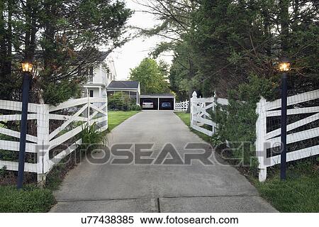 White fence and lamp posts at end of driveway; Potomac; Maryland; USA View Large Photo Image Stock Photography - White fence and lamp posts at end of driveway; Potomac; Maryland; USA. Fotosearch