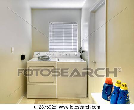 White laundry room in traditional home View Large Photo Image Stock Photography - White laundry room in traditional home. Fotosearch