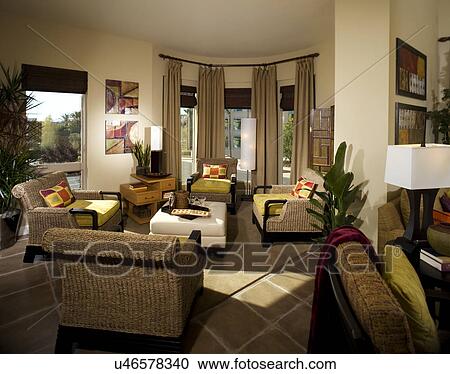 Stock Image - Wicker armchairs in home sitting area; Aliso Viejo; California; USA. Fotosearch