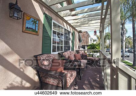 Stock Photo - Wicker chairs at porch, Laguna Beach, California, USA. Fotosearch
